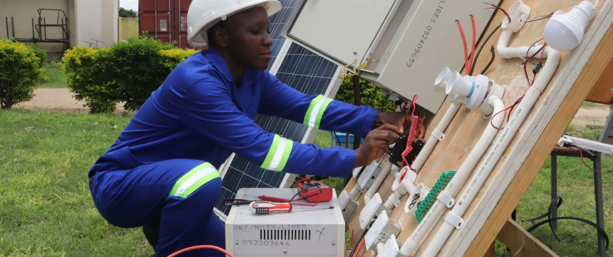 A TVET student doing practical lessons in renewable energy. 