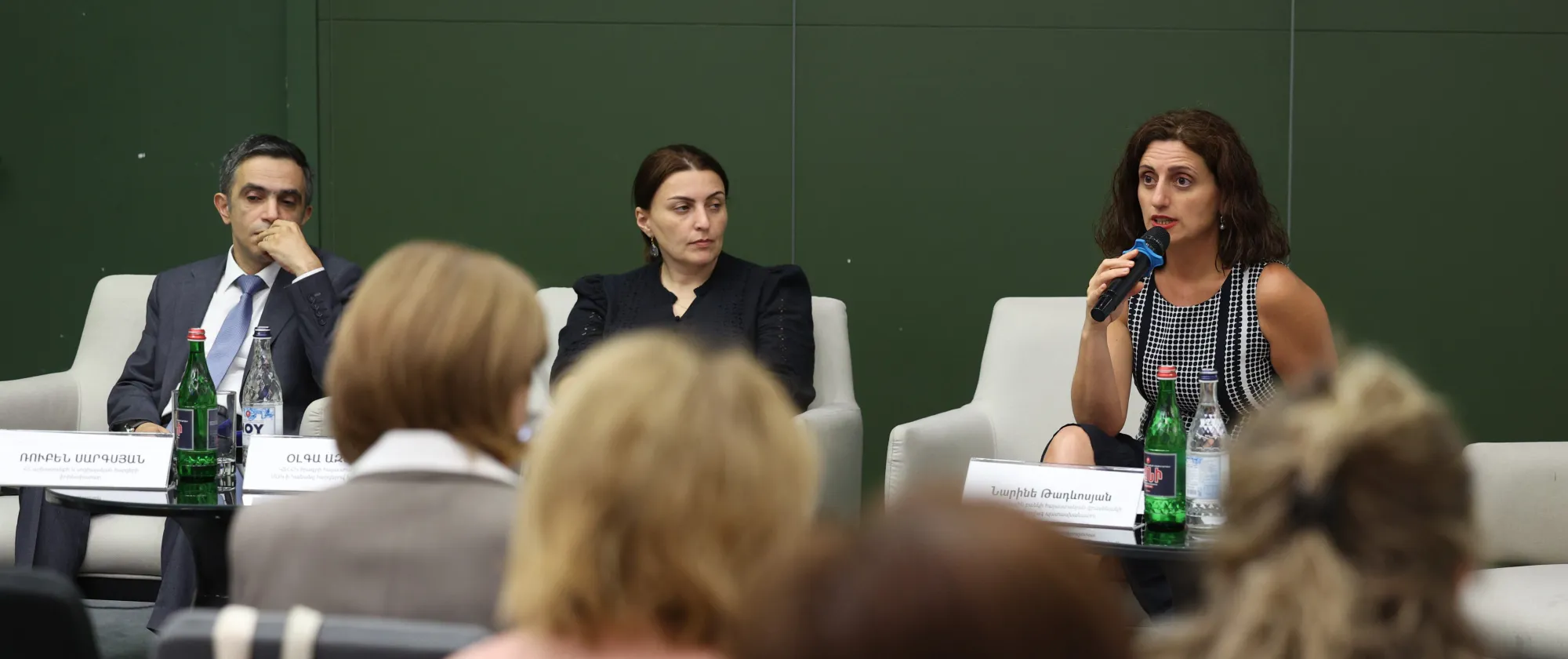 Panellists sitting in front of audience