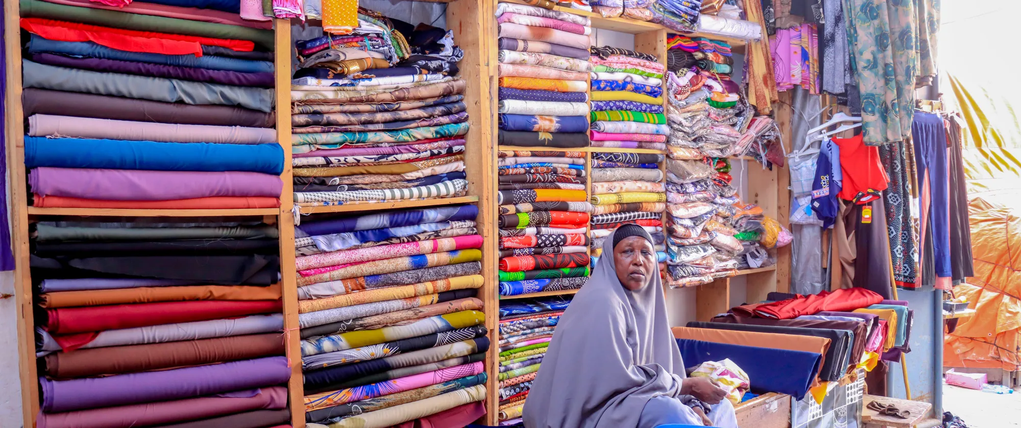 Faadumo Sahal Mohamed, a textile supplier in Mogadishu, at work.