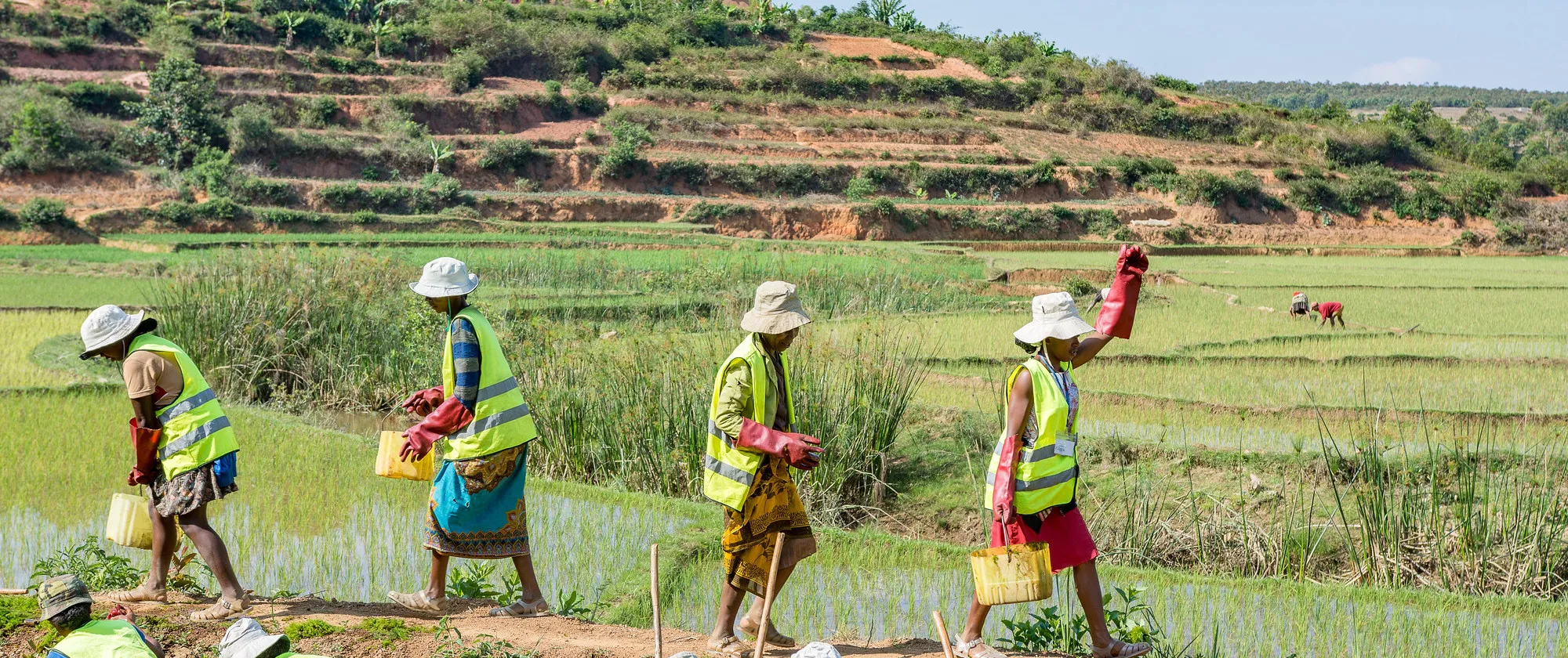 Workers on a canal carry out regular maintenance work in Madagascar.