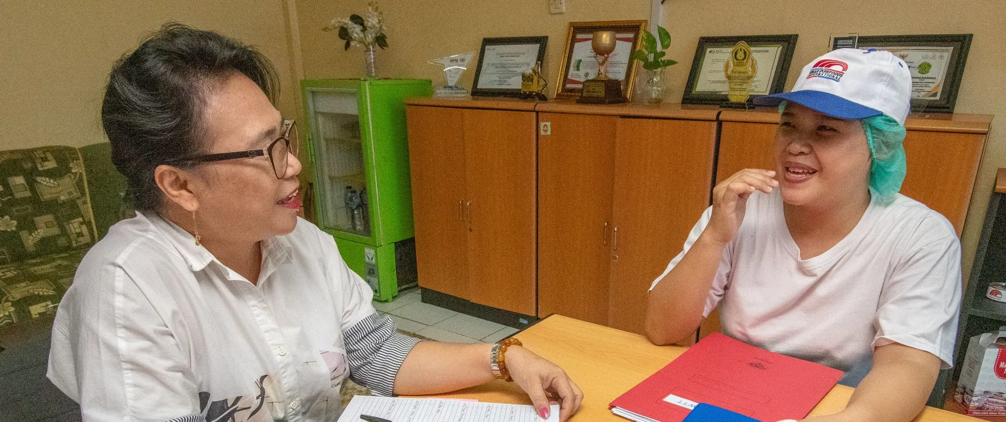 a female supervisor interviews a female worker