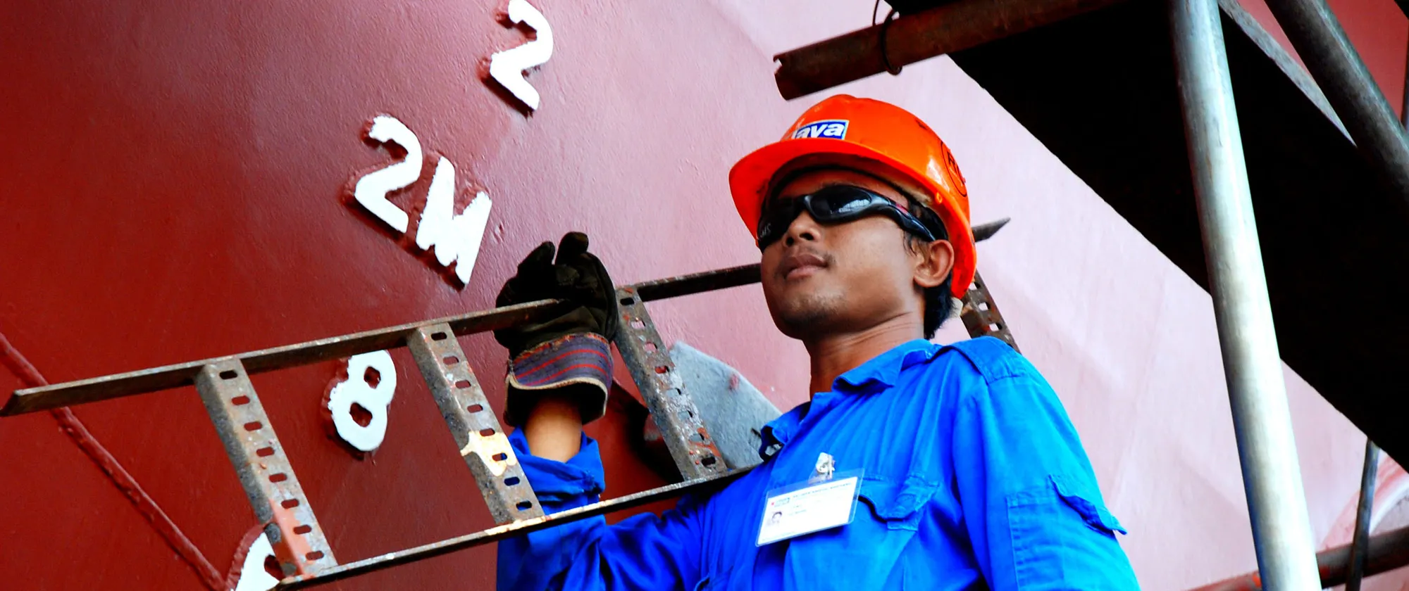 seafarer carrying a ladder