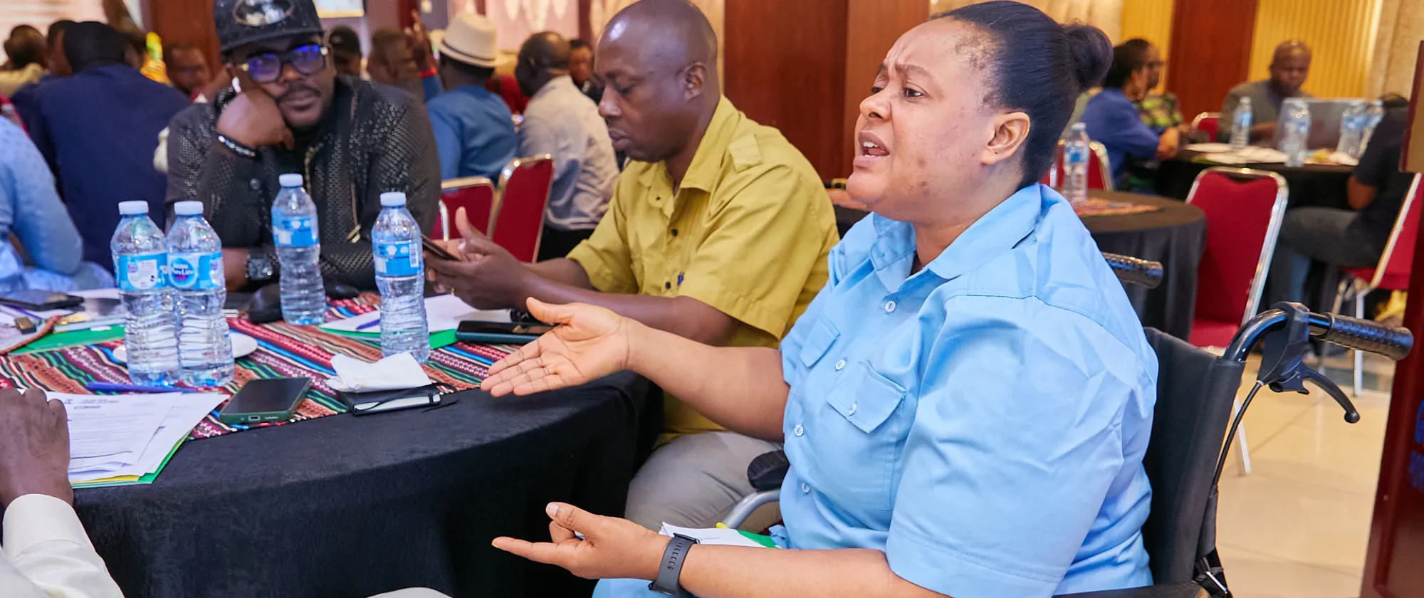 A participant addresses the audience during a session.