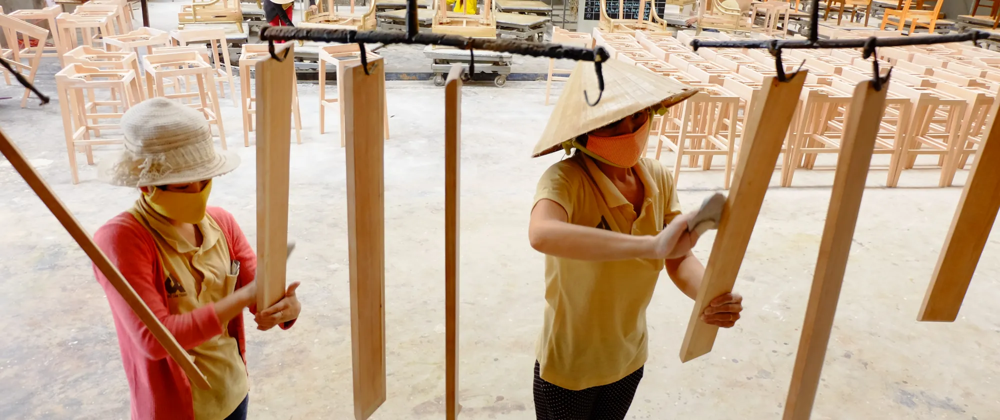Female worker working at wood enterprise benefited from ILO's support