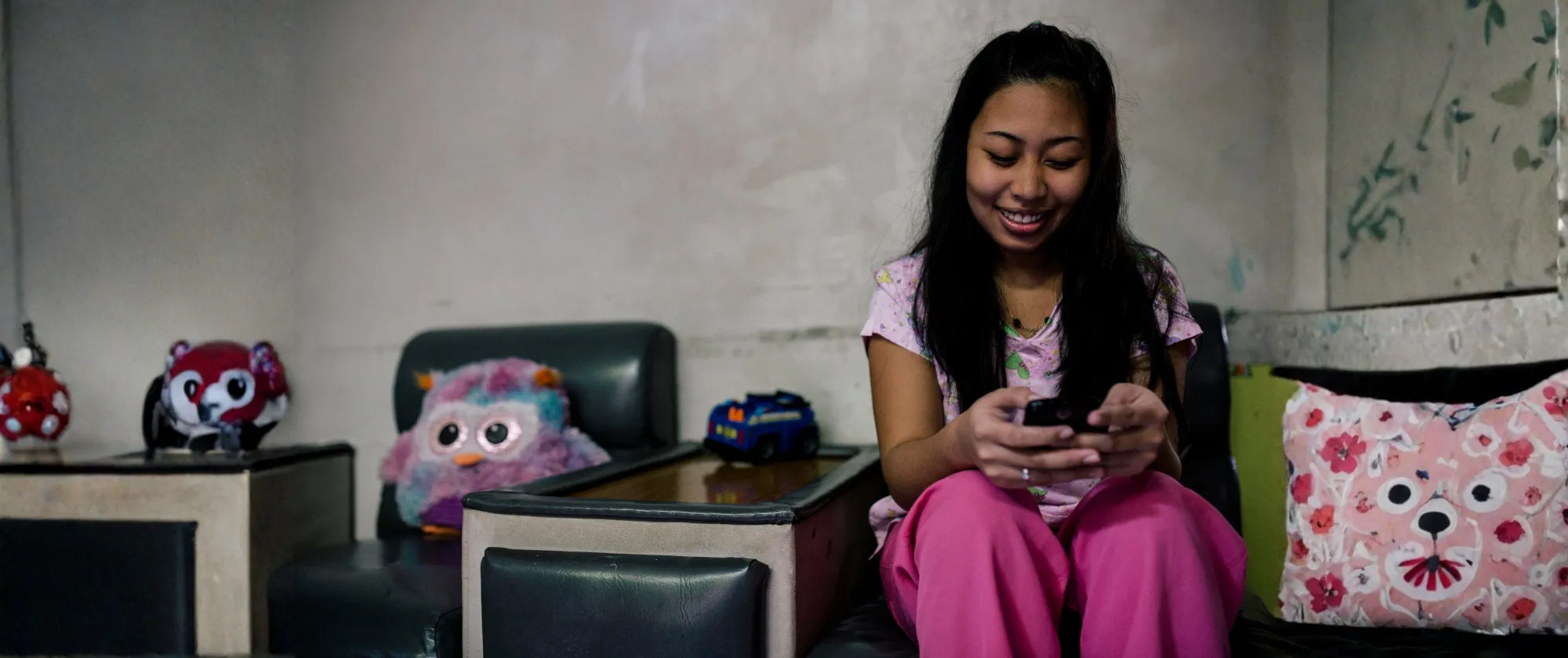 Mobile phones help domestic workers stay connected with friends and family.