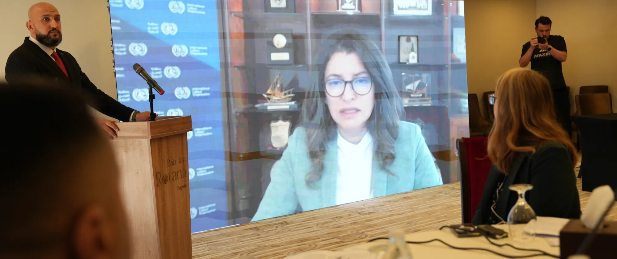 Dr Ruba Jaradat appearing in a video message at a meeting
