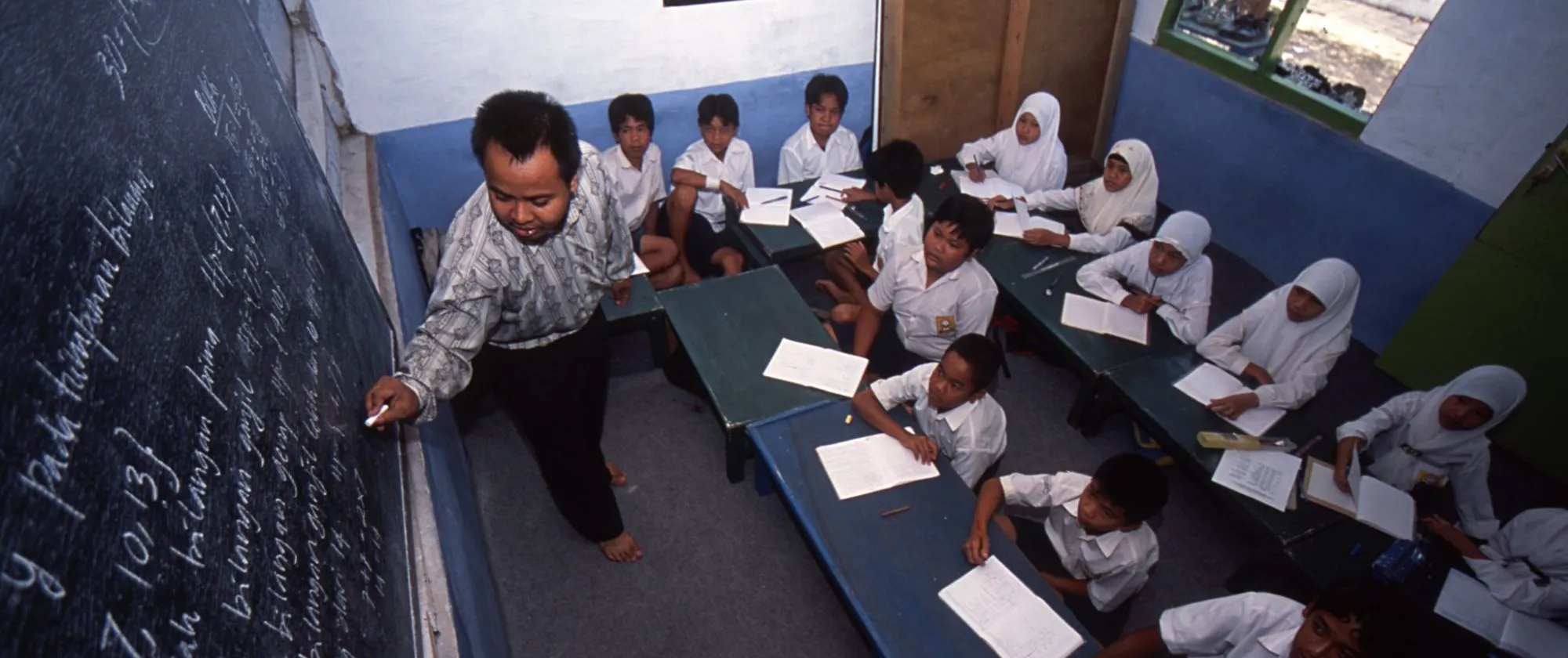 a teacher and students in a classroom
