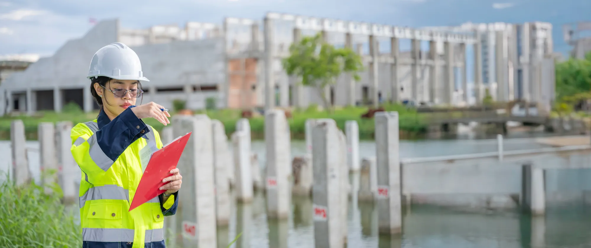 A woman examining a building.