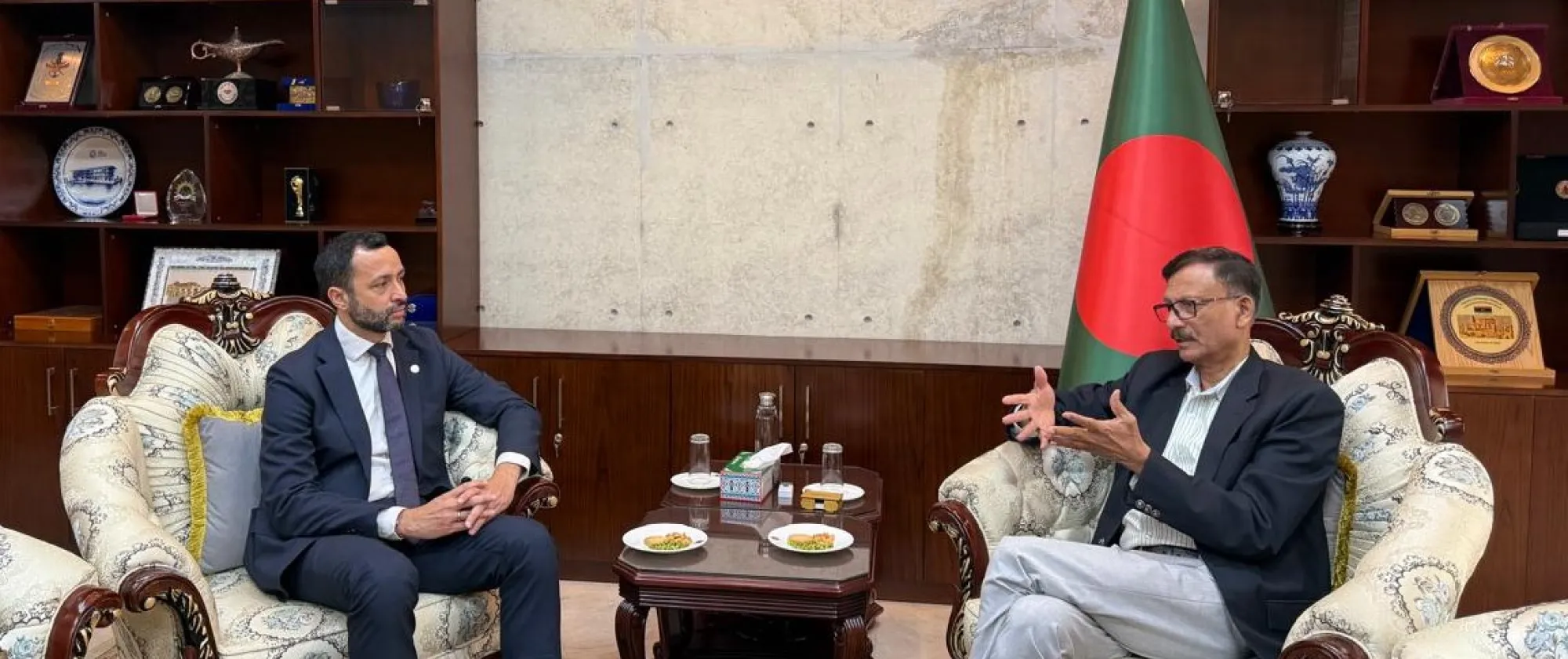 Two men in discussion seated in an office