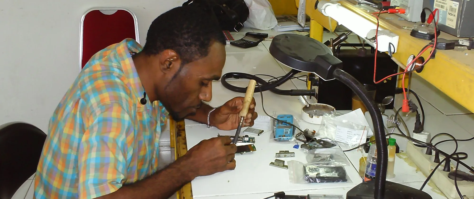 a young man in Papua becomes an entrepreneur in his own mobile phone store