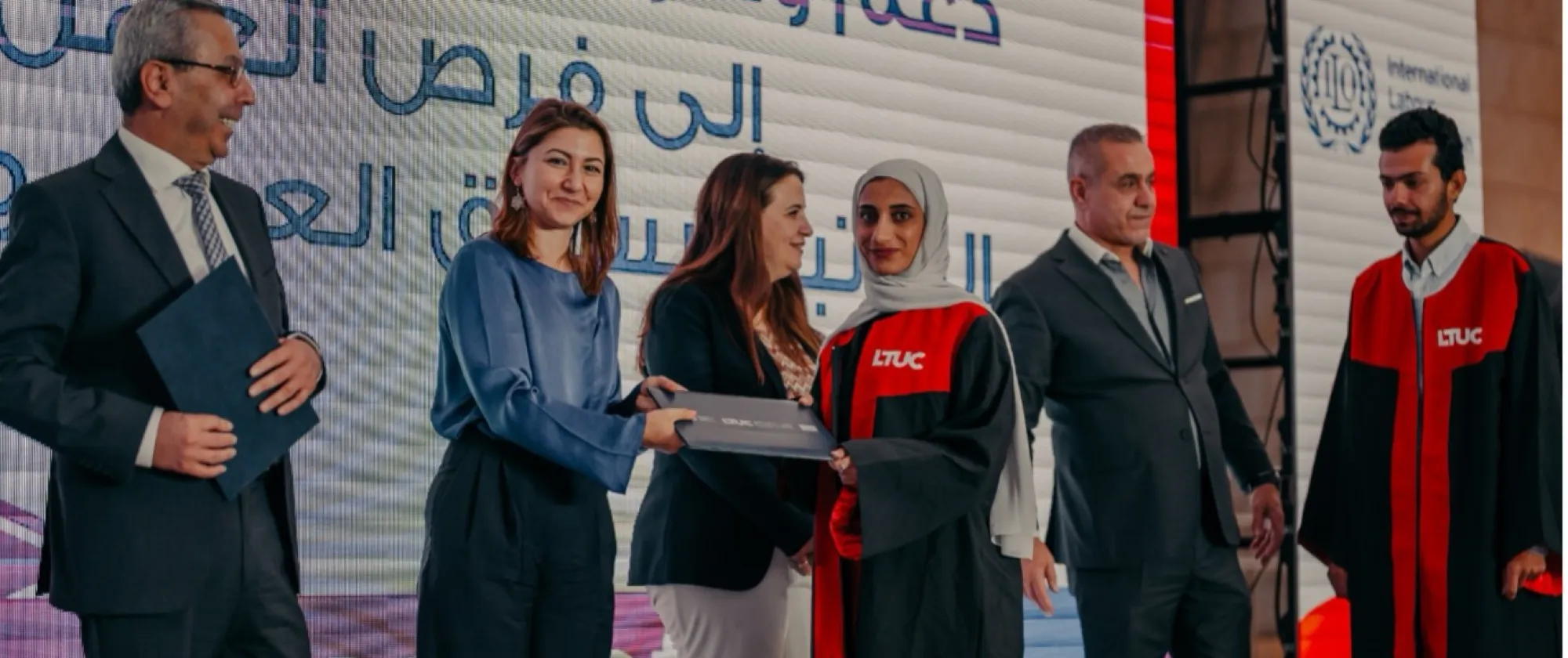 A female student receives her diploma