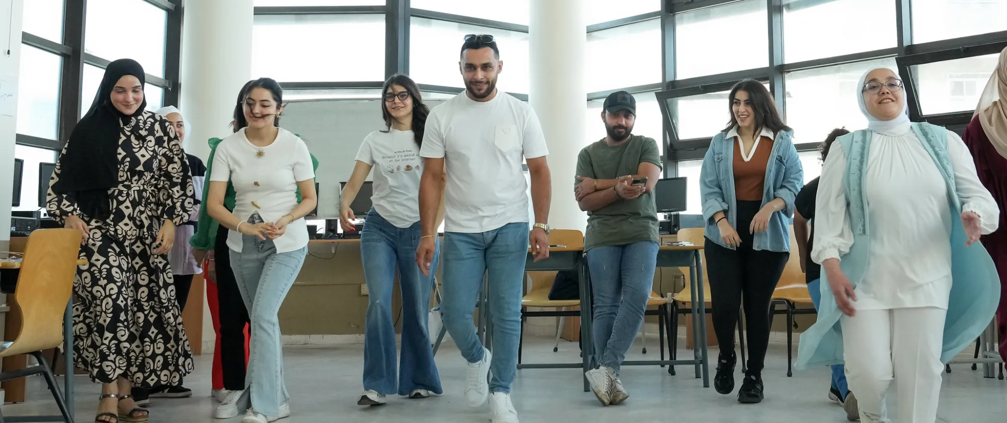 Men and women posing at event in Jordan
