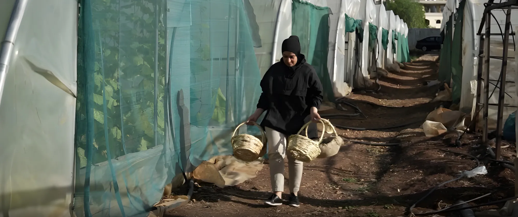 female worker carrying baskets