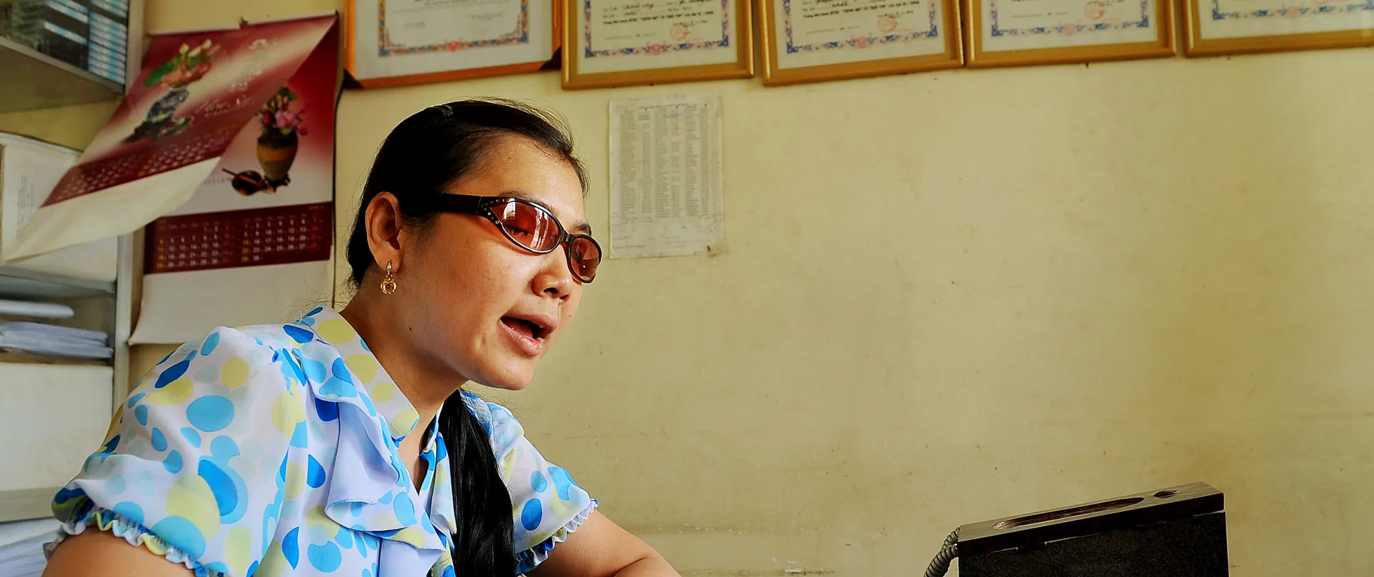 A blind woman reading braille