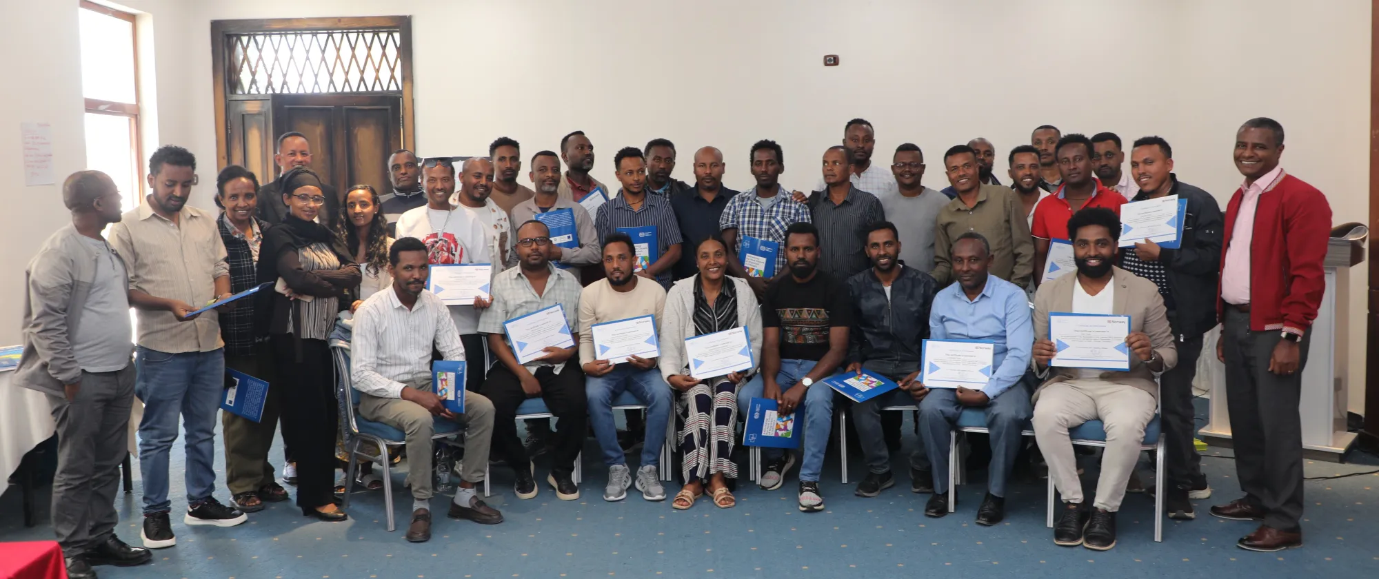 Group of trainnes posing with their certifications
