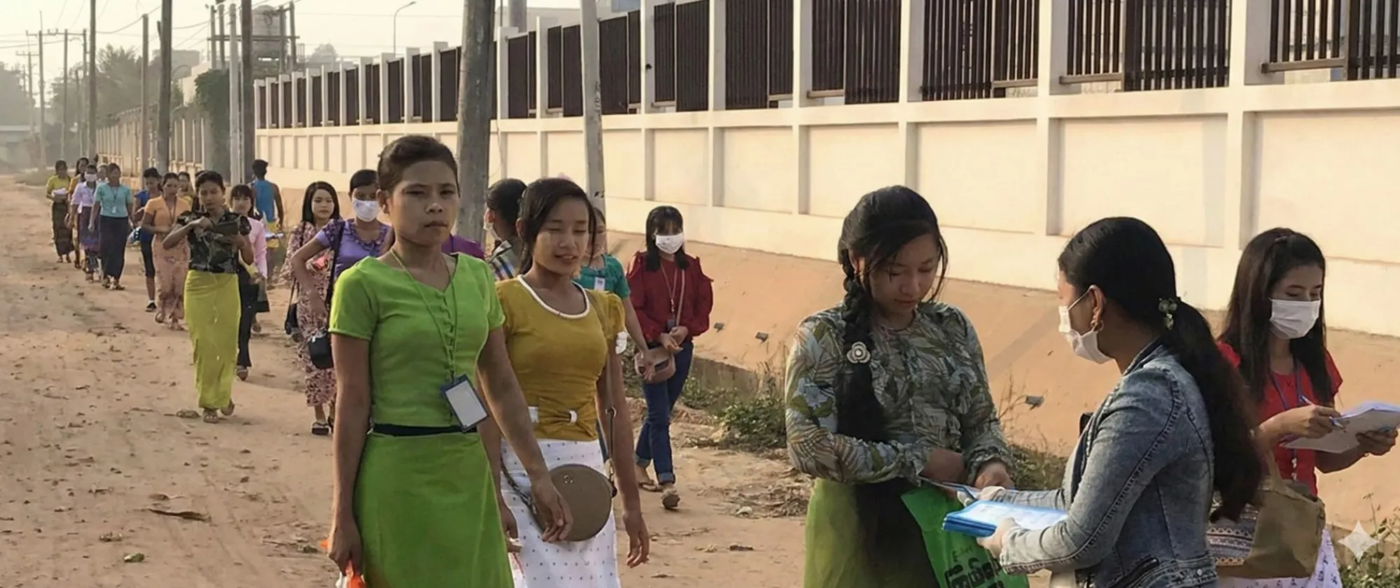 A group of potential migrant workers in Lao PDR listen to migration information.