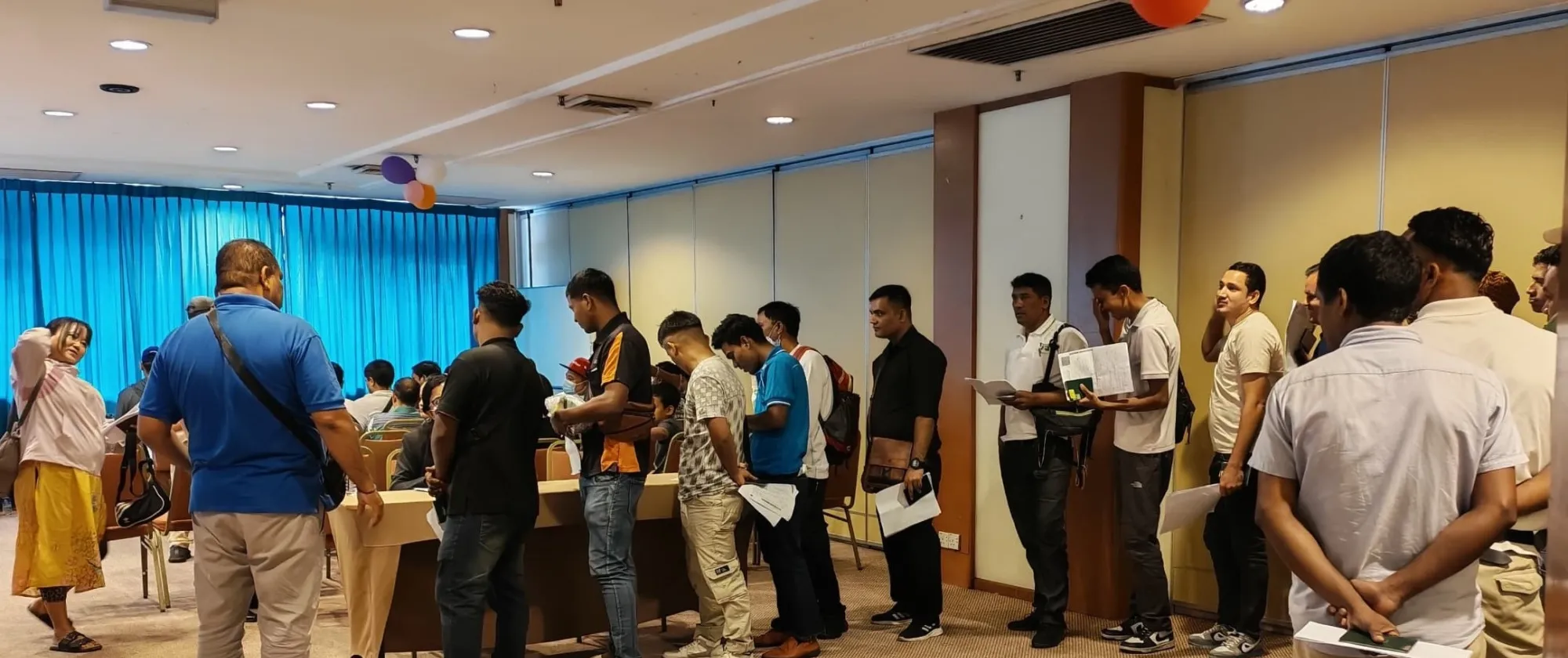 Nepali migrant workers participating in pasport renewal camp organized by Nepal Embassy in Joharbaru, Malaysia.