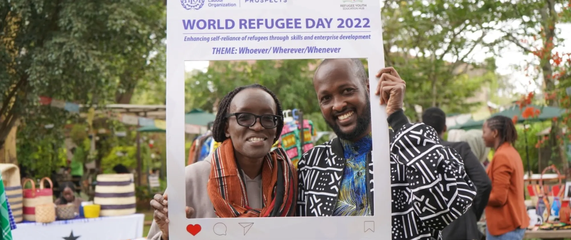 man and woman holding a placard