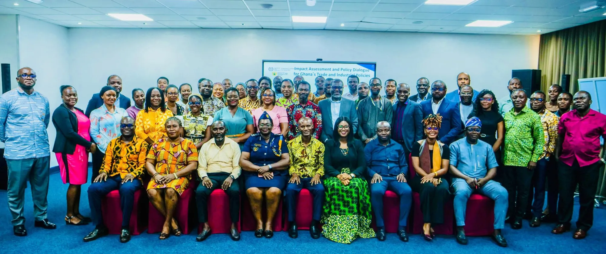 A large group of stakeholders posing for a photo during the national dialogue on trade and industrial policy review in Ghana.