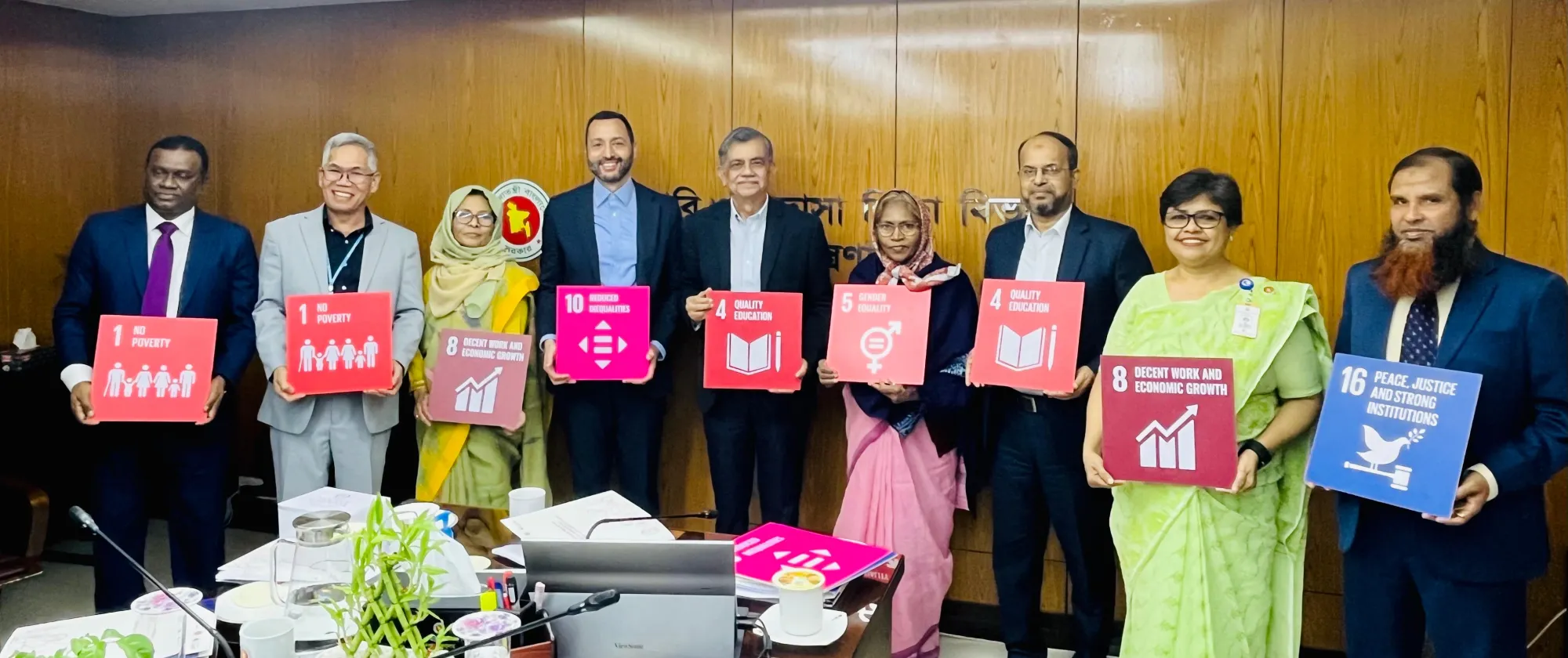 Representatives from line ministries and ILO Country Director with the Adviser, Ministry of Education.