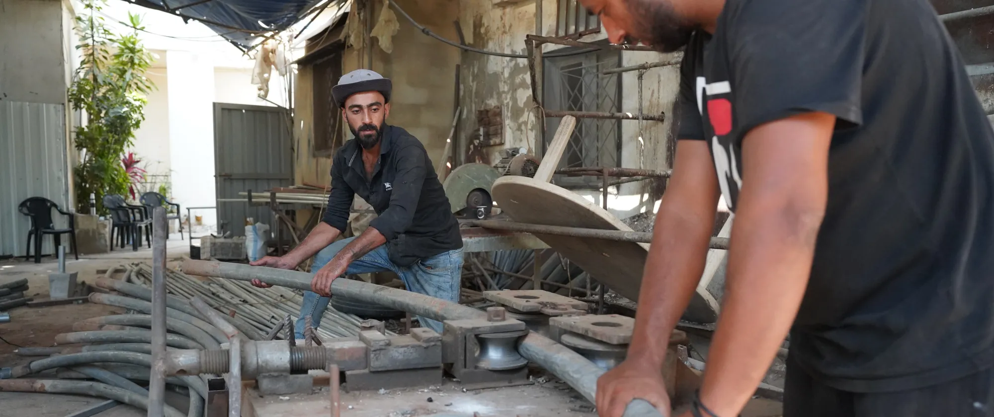 Local welders transforming traditional greenhouse frames into upgraded structures. Akkar, Lebanon. July 2025