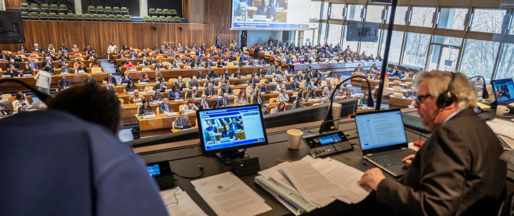View of the ILO Governing Body meeting from the cabin of an interpreter as a meeting is going on.