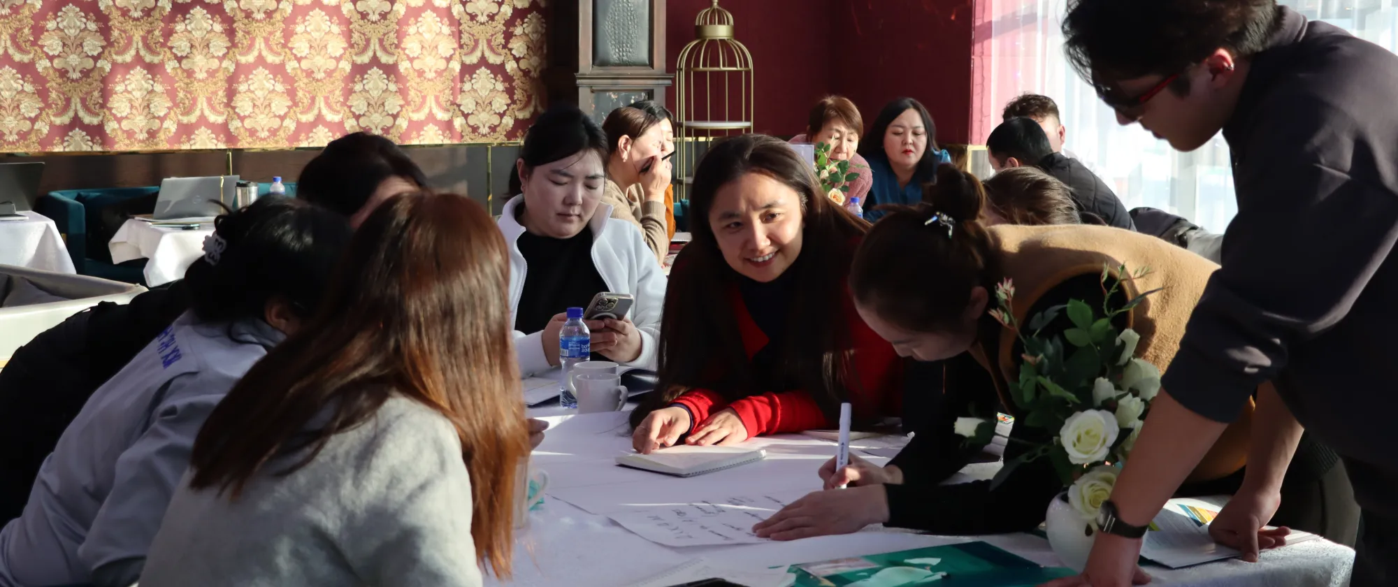 OSH training participants during the teamwork, with assistance of an ILO trainer