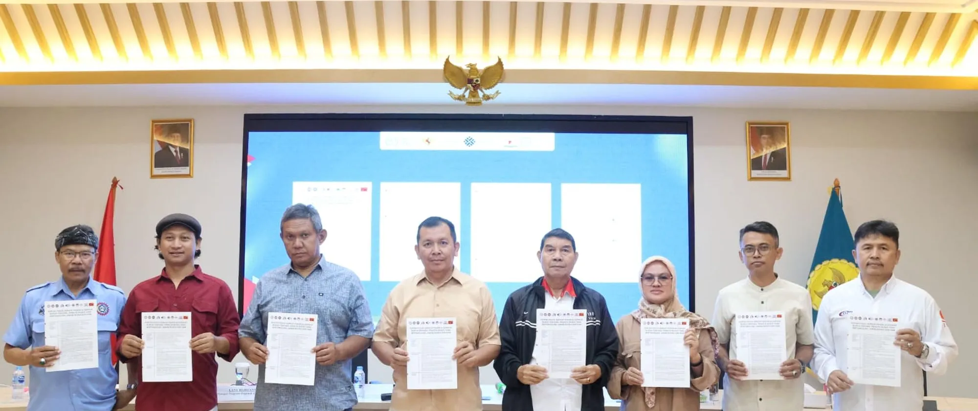 Eight trade union representatives holding a position paper