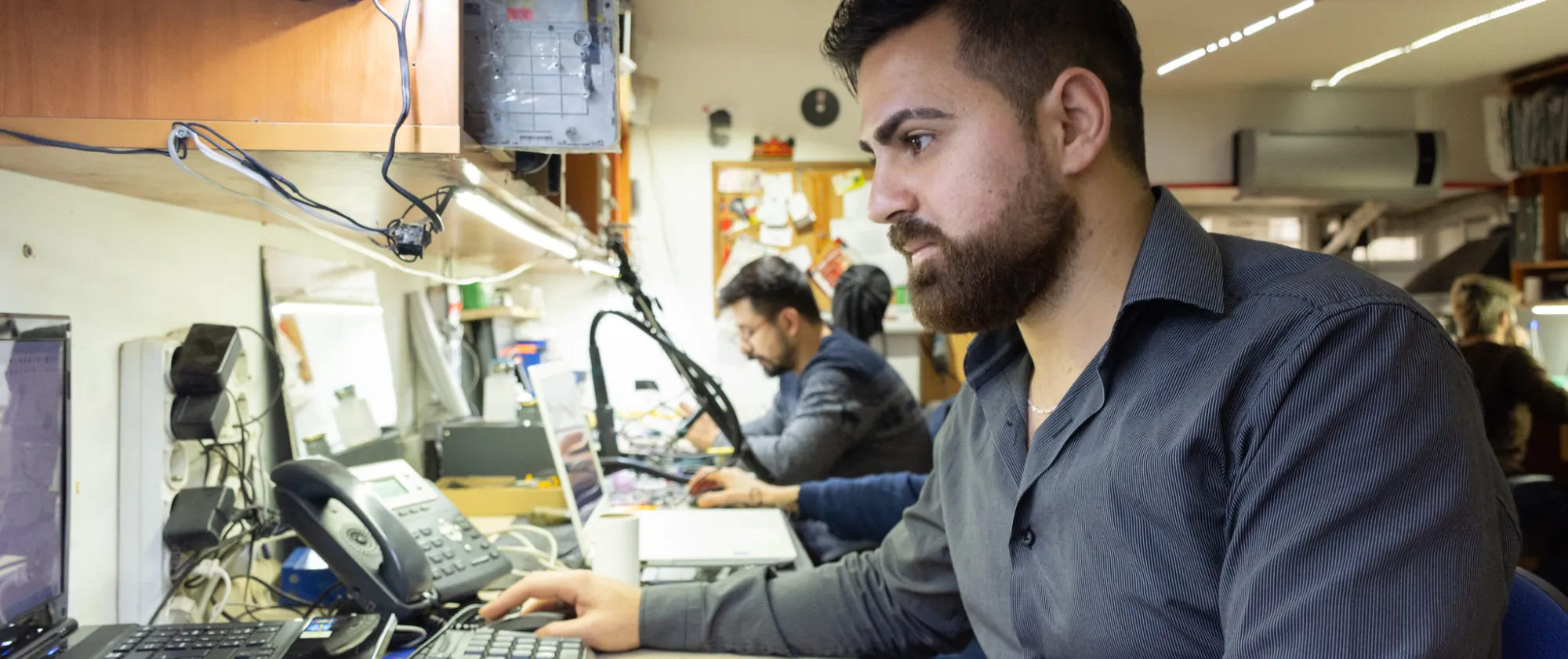 A young Syrian employee working as a technical service personnel in the IT sector, in Ankara, Turkey. He participated on the job training programme where he developed both his technical and social skills. 