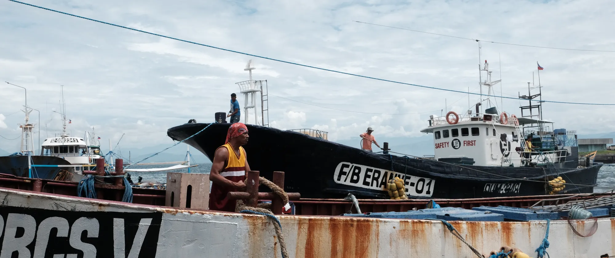 Boat docked at General Santos Port showing Safety First Sign