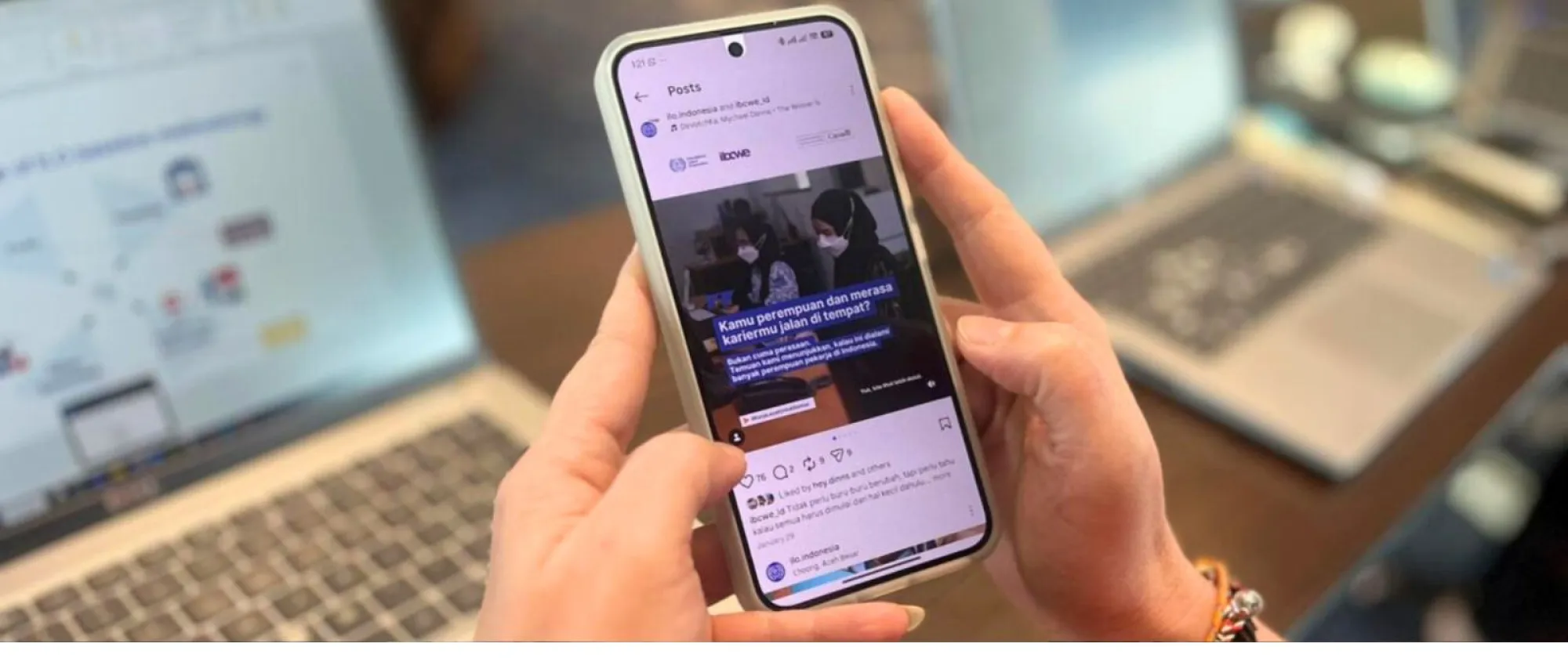 A hand holding a smartphone