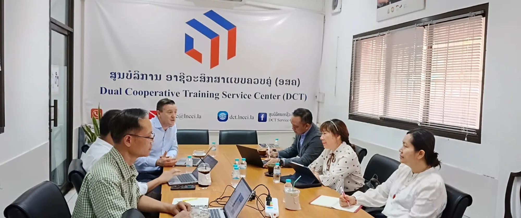 People in meeting room.