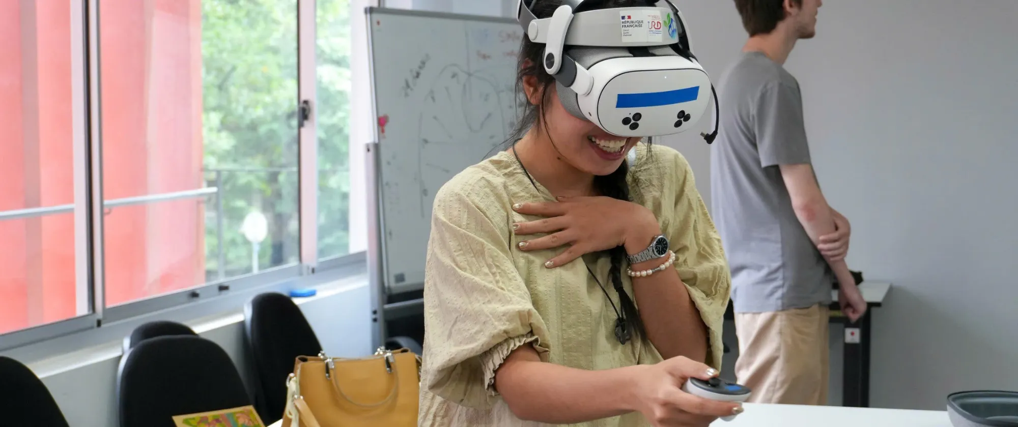 Thao using a VR headset and controller.