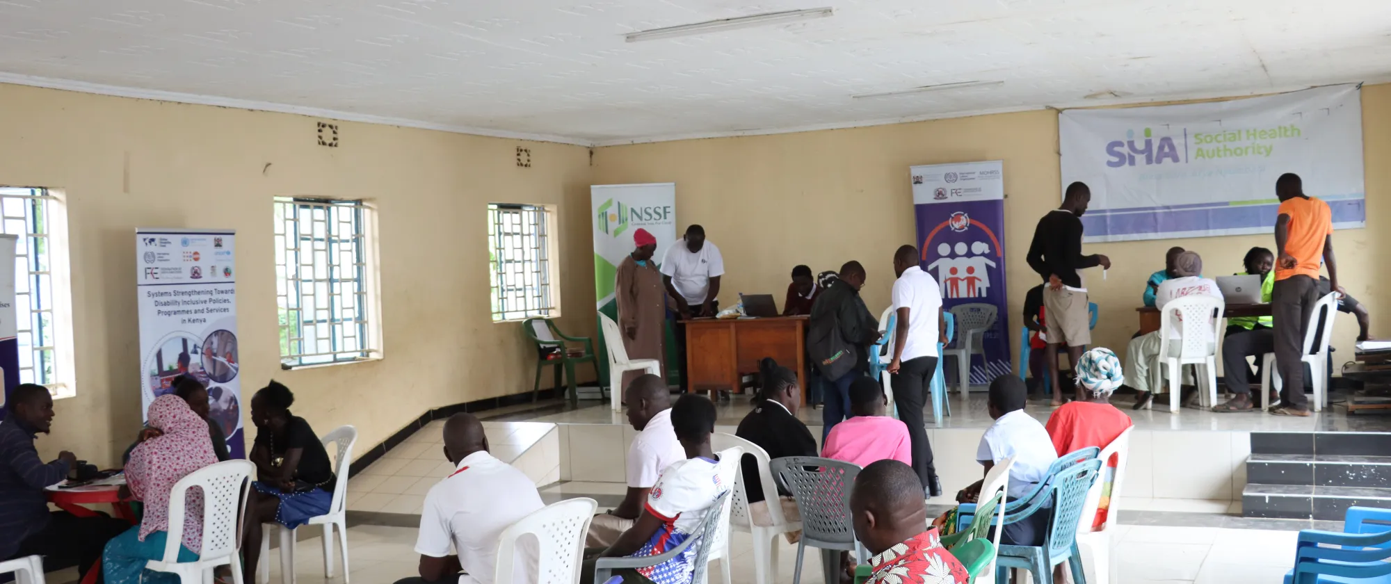 Community members engage with service providers during a Social Protection Fair at Changamwe Social Hall in Mombasa, where services including NSSF, SHA, occupational safety and health advisory, MSME support and health screenings were brought closer to workers in the informal economy, improving access and responsiveness.