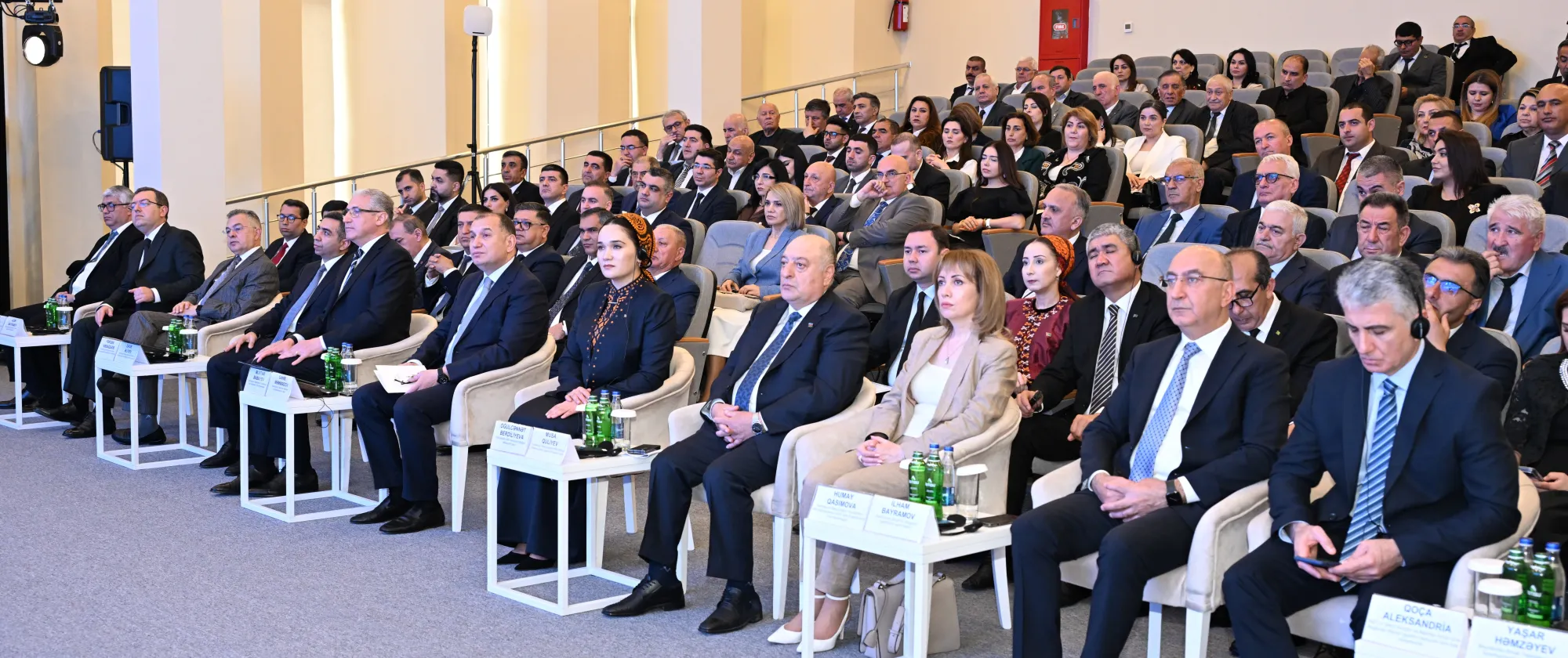 Participants seated in an auditorium 