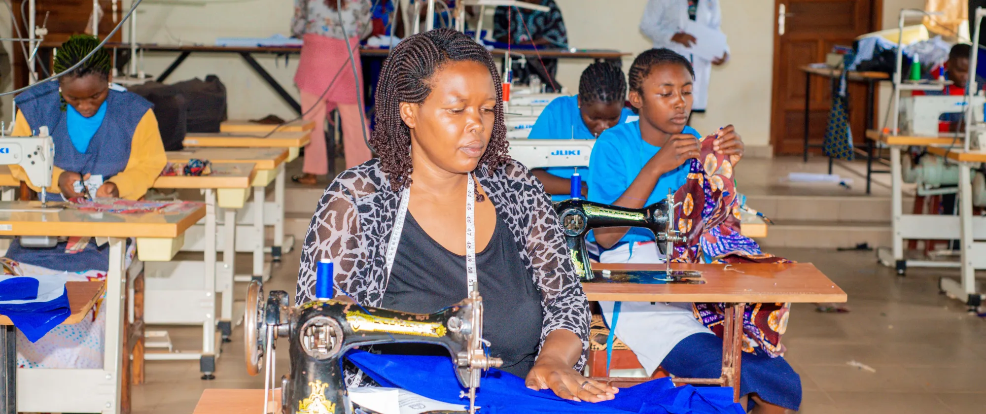 woman learning tailoring