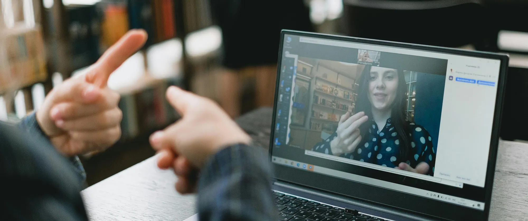 Person using sign language on an online meeting