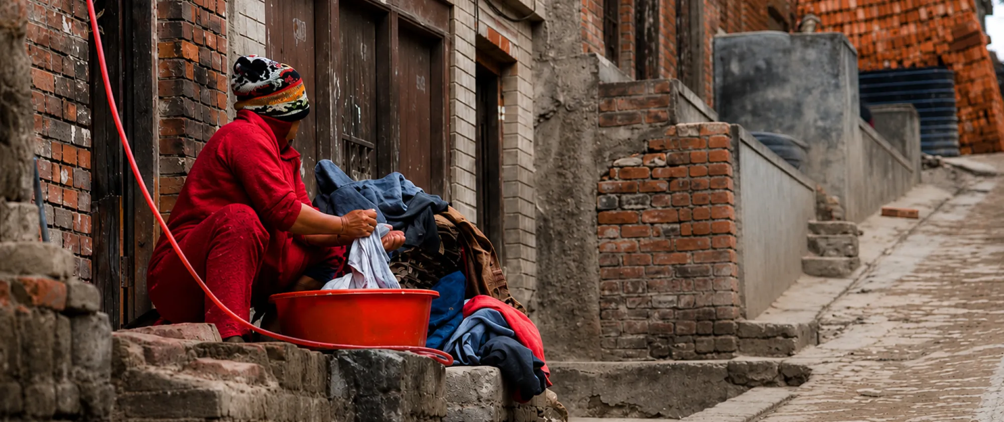 A woman washing clothes in Patan, Nepal