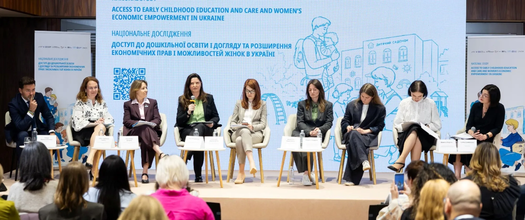 Panelists of a conference on stage