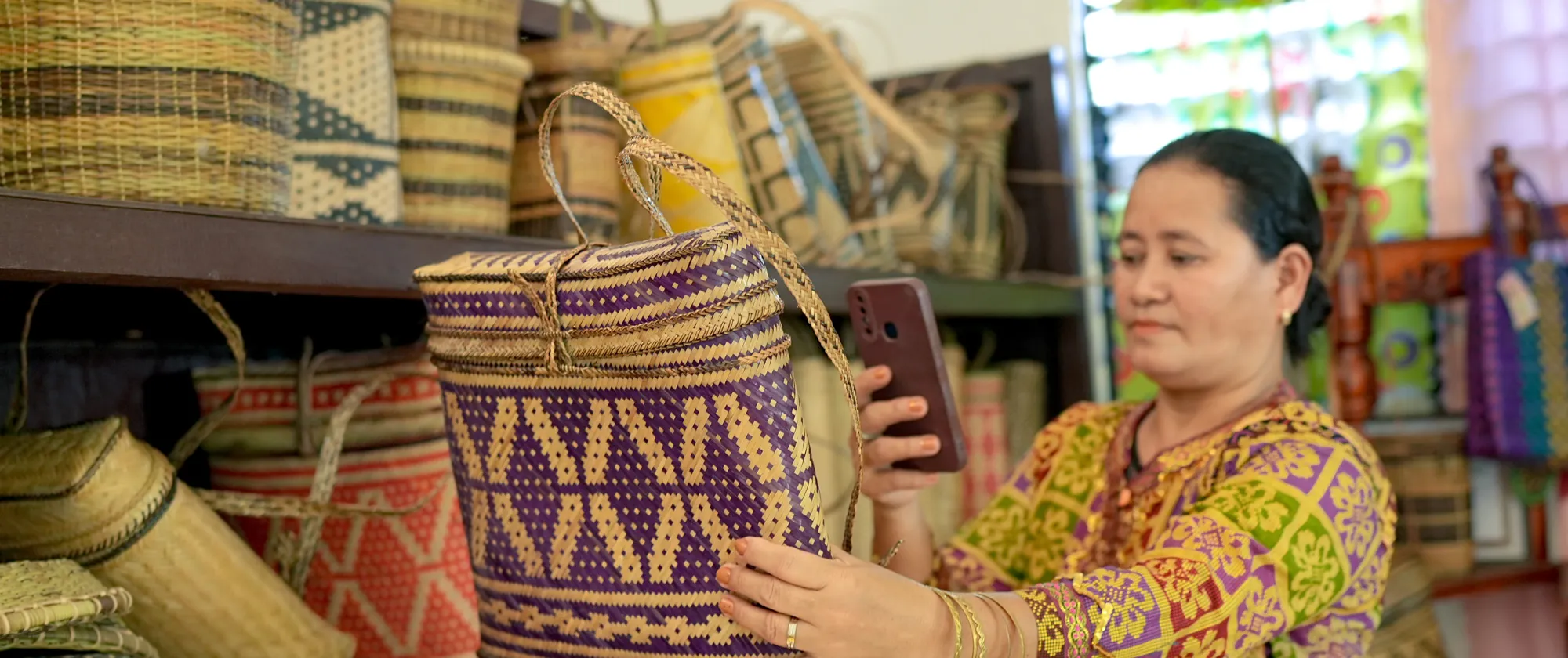 a woman entrepreneur using her mobile phone