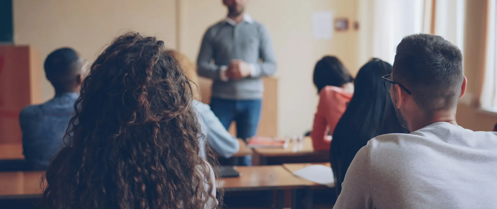 Teachers teaching in front of class