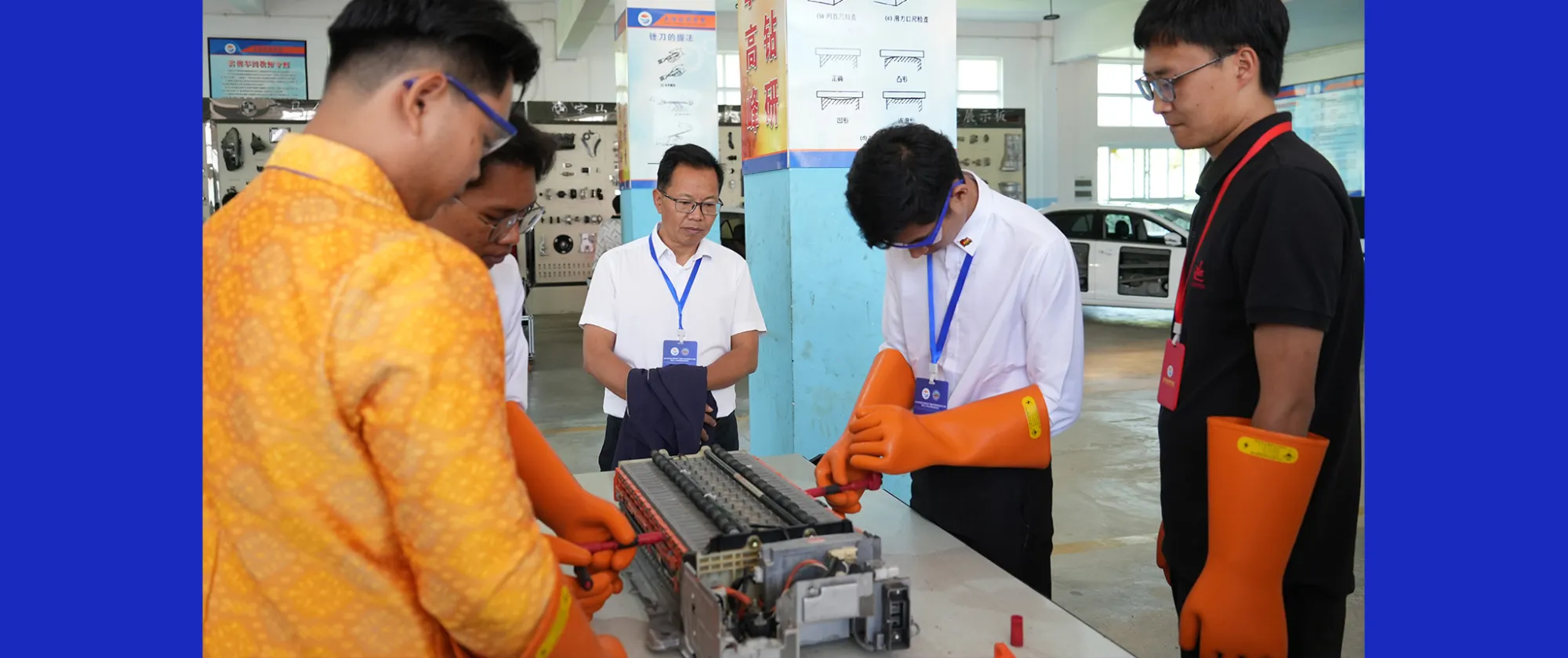 Several people gather around an engine. 