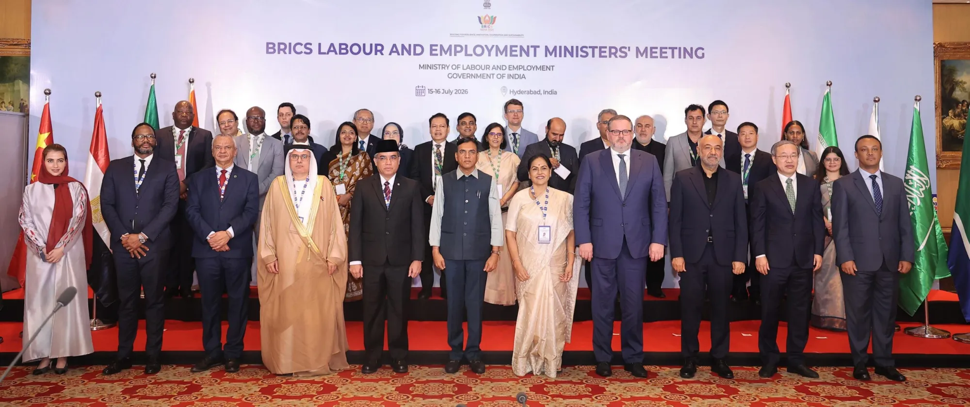 Labour and employment ministers and senior representatives from BRICS countries pose together on stage
