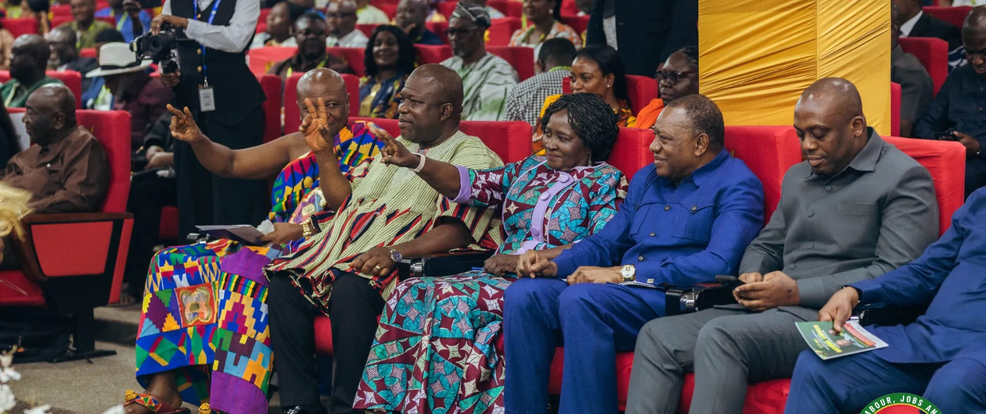 Senior officials and representatives from government, employers and workers sit together