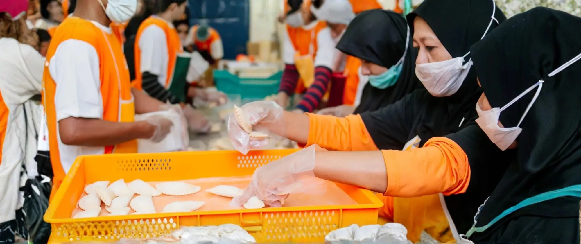 Workers in doing food processing in the Halal foods industries