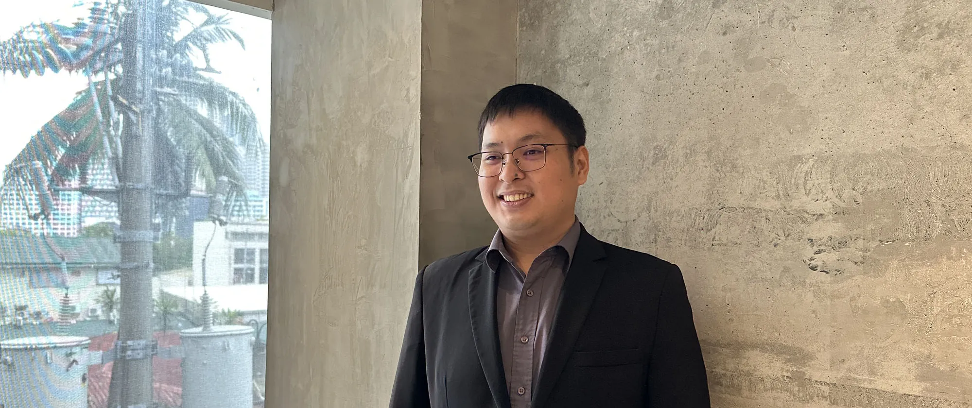 Engineer Joseph Daniel Bianes, a 32-year-old Associate Professor at the Polytechnic University of the Philippines standing and smiling.