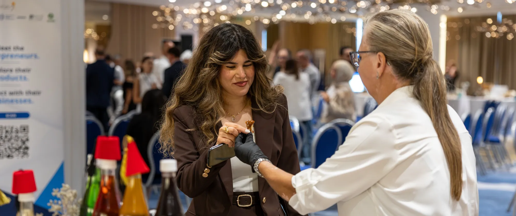 Visitors of the ENABLE entrepreneurship event, engage with a participating entrepreneur and explore locally produced items showcased during the exhibition. Beirut, Lebanon 22 September 2026