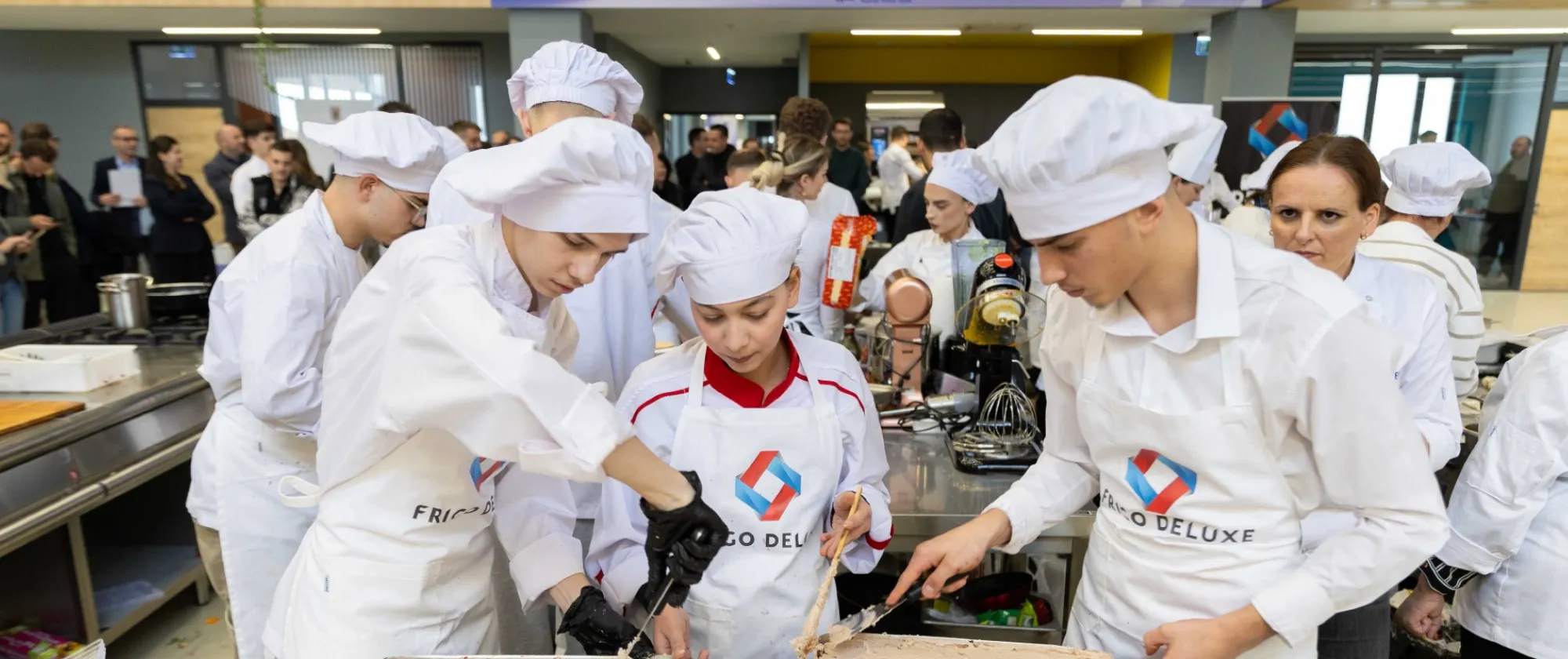 Students are preparing a dish together. 