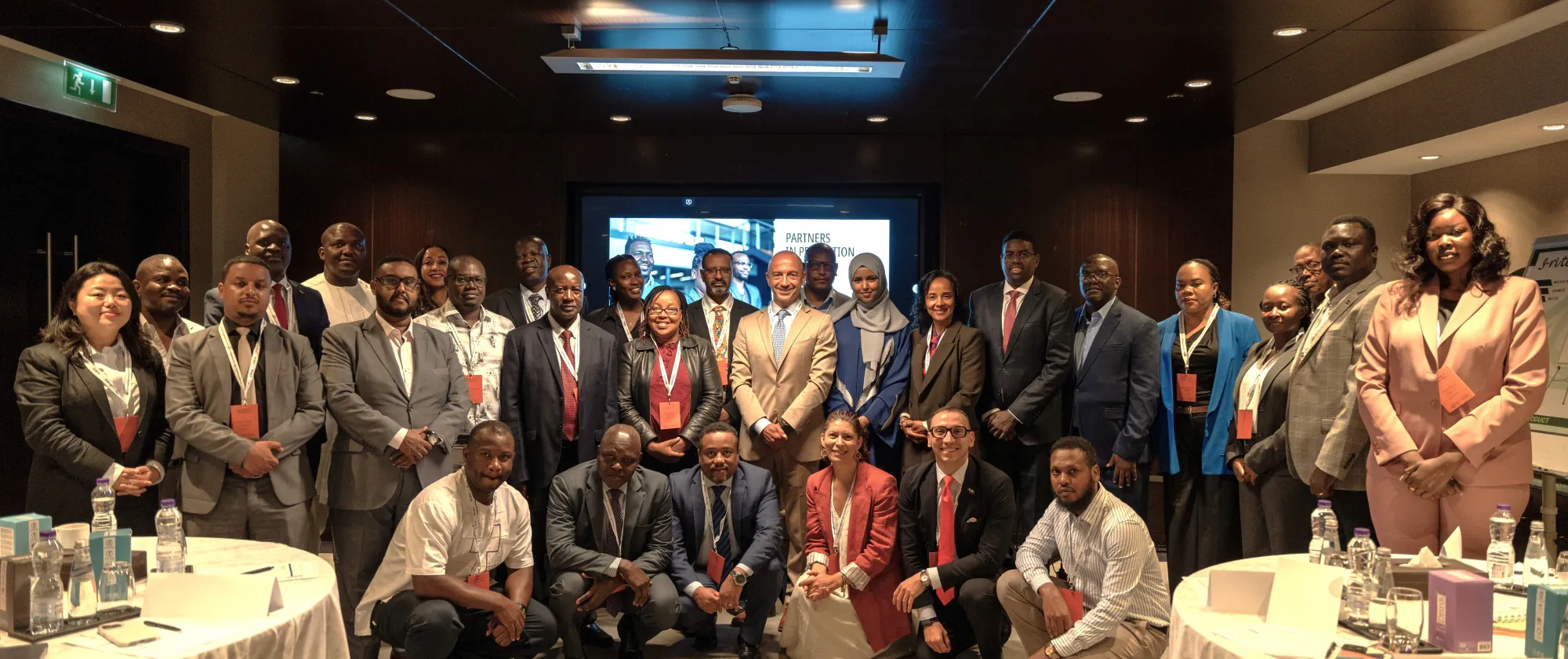 Group photo of participants at a regional labour migration meeting
