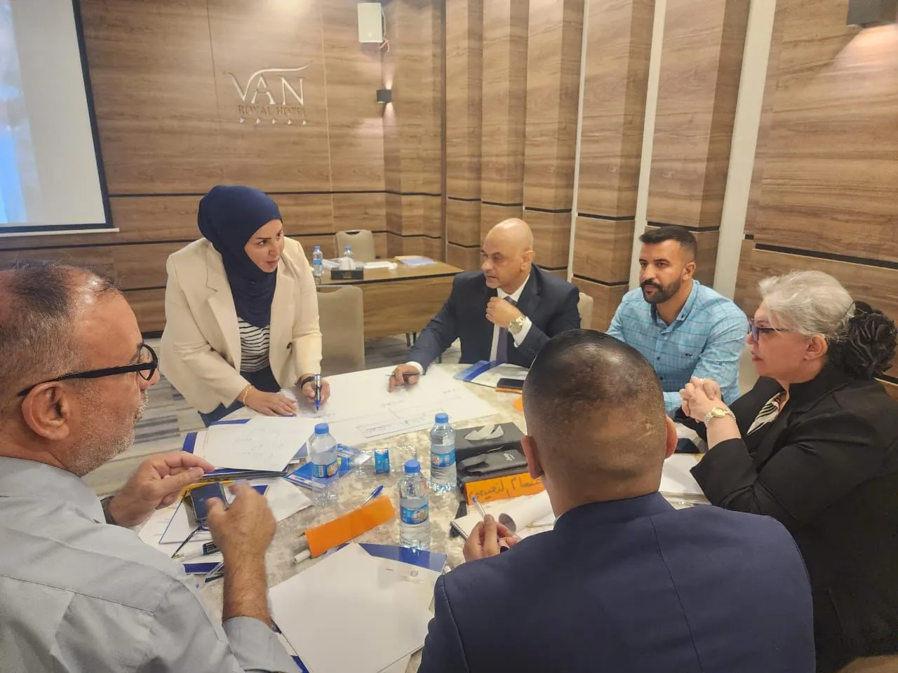 a group of people working together during a workshop